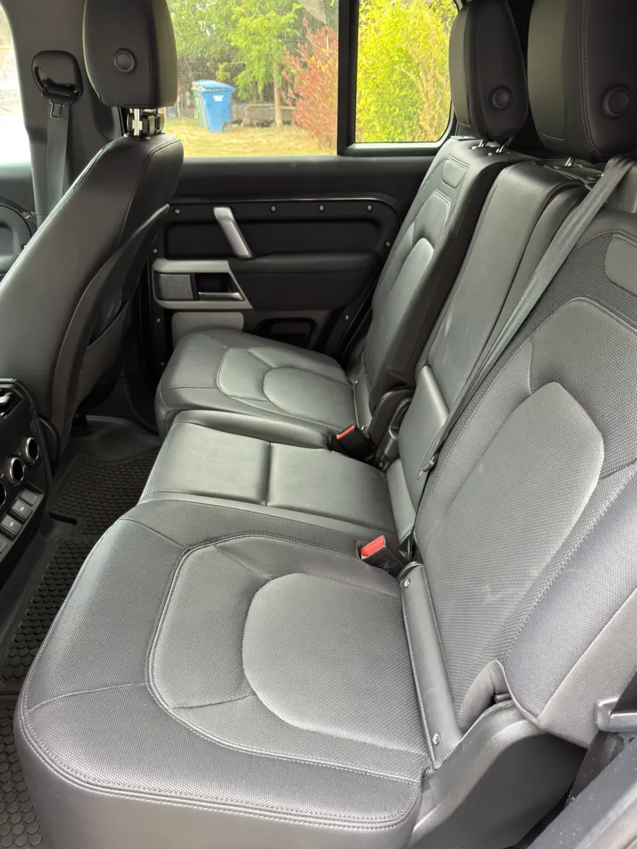 Before: rear bench seats with dust and marks on the leather